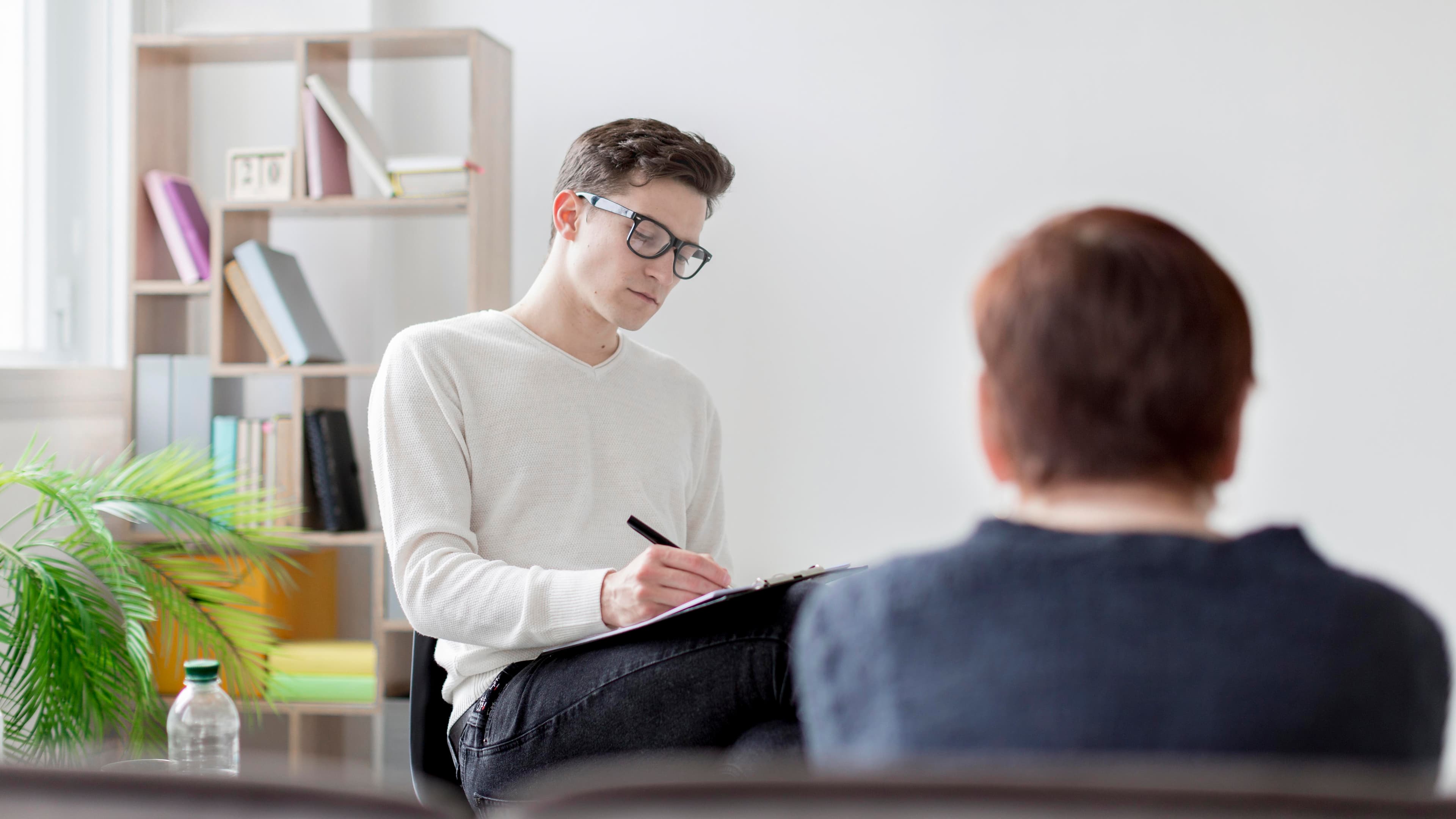 Mental health support session - Professional psychologist consulting with client